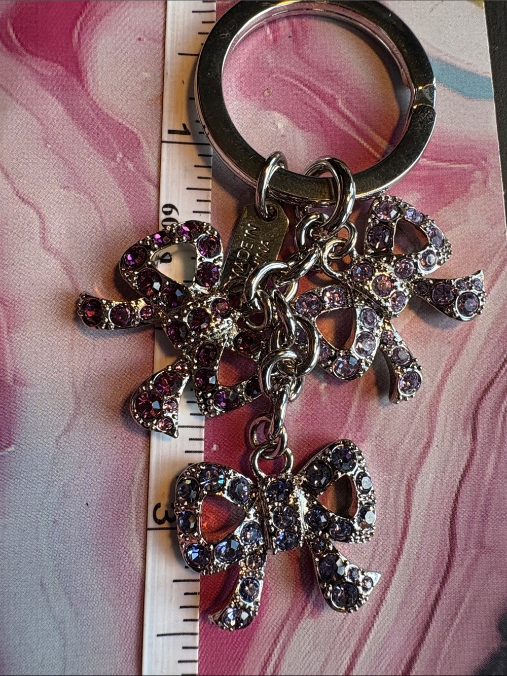 Coach Silver-Tone Bow keyring with Purple Crystals